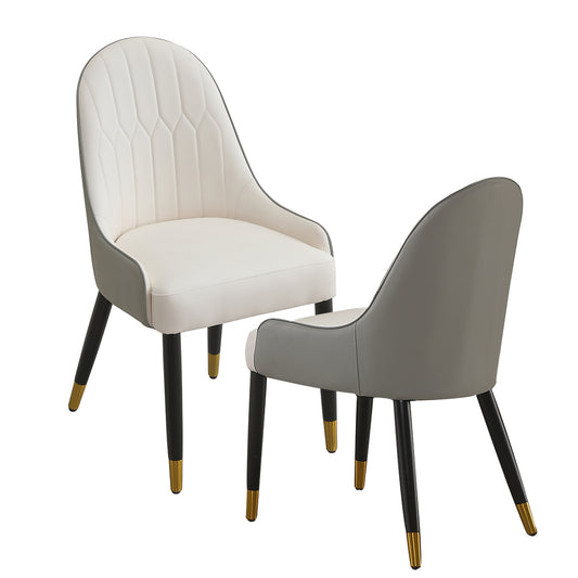 White and gray upholstered accent chair with gold tipped black legs