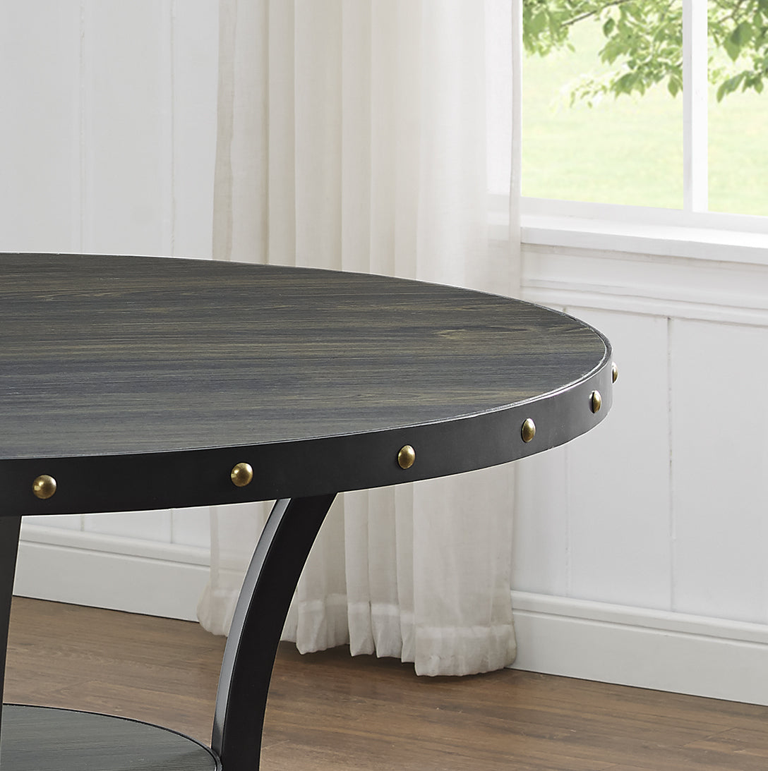 Round distressed wood dining table with black metal band and rivets