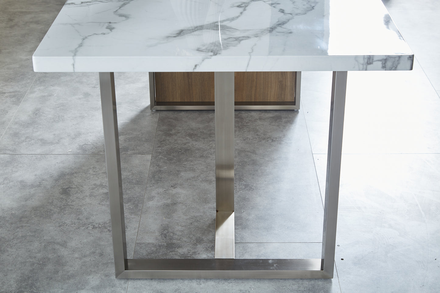 Modern white marble top dining table with brushed steel legs