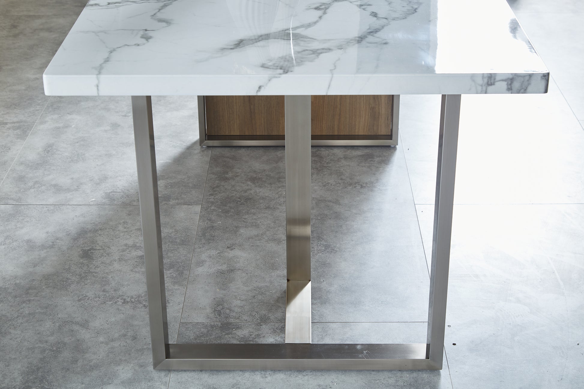 Modern white marble top dining table with brushed steel legs