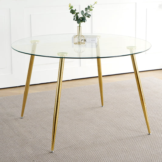 Round glass dining table with gold hairpin legs