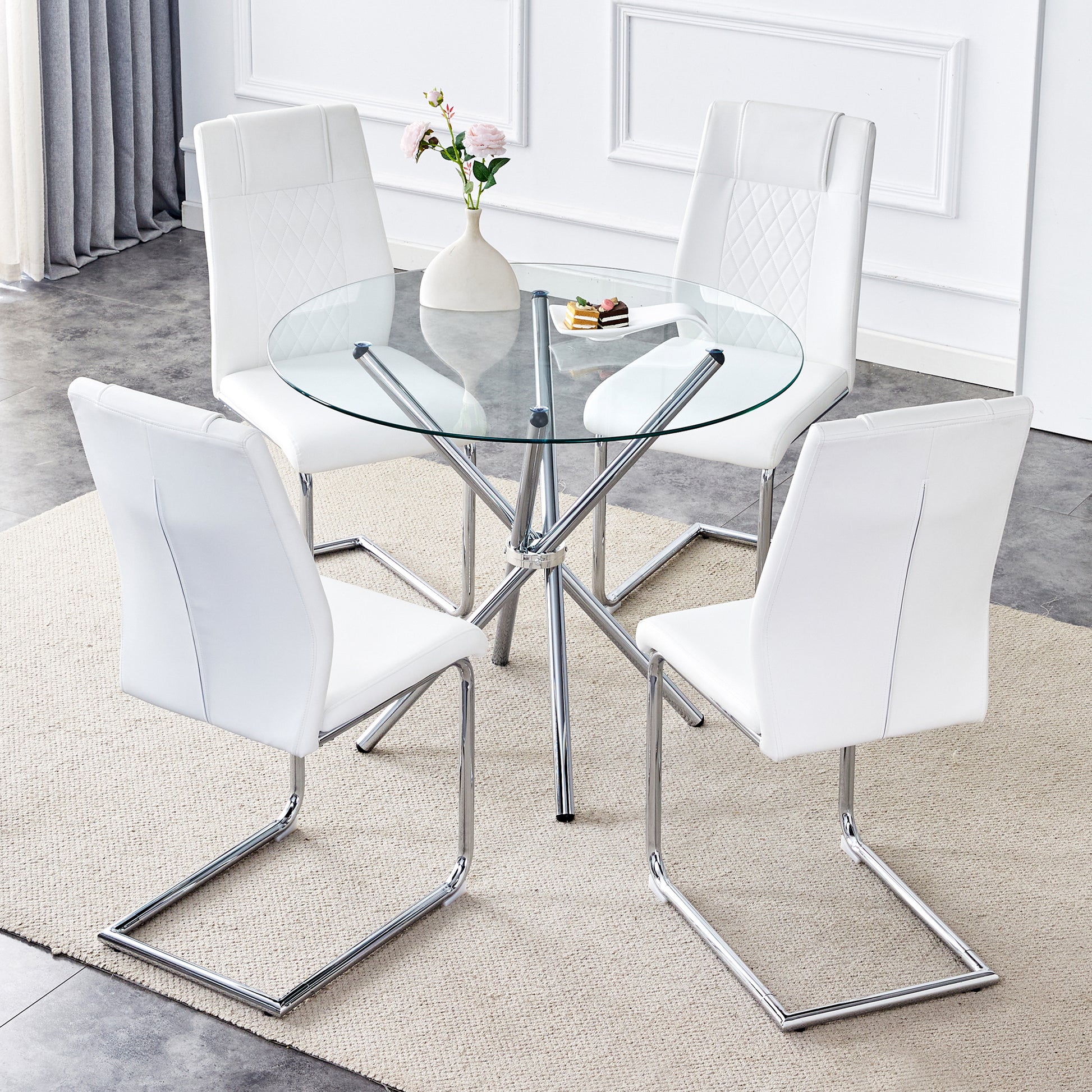 White faux leather dining chairs with diamond stitching around a round glass table