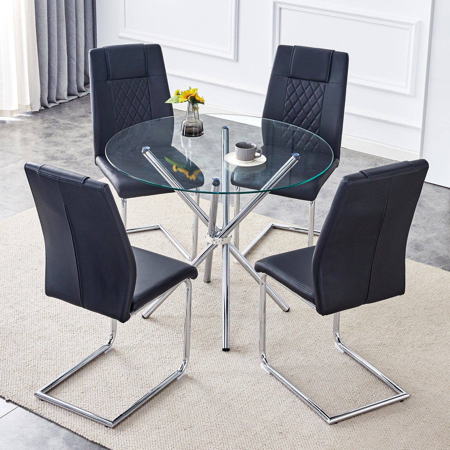 Black faux leather dining chairs with diamond tufting around glass table