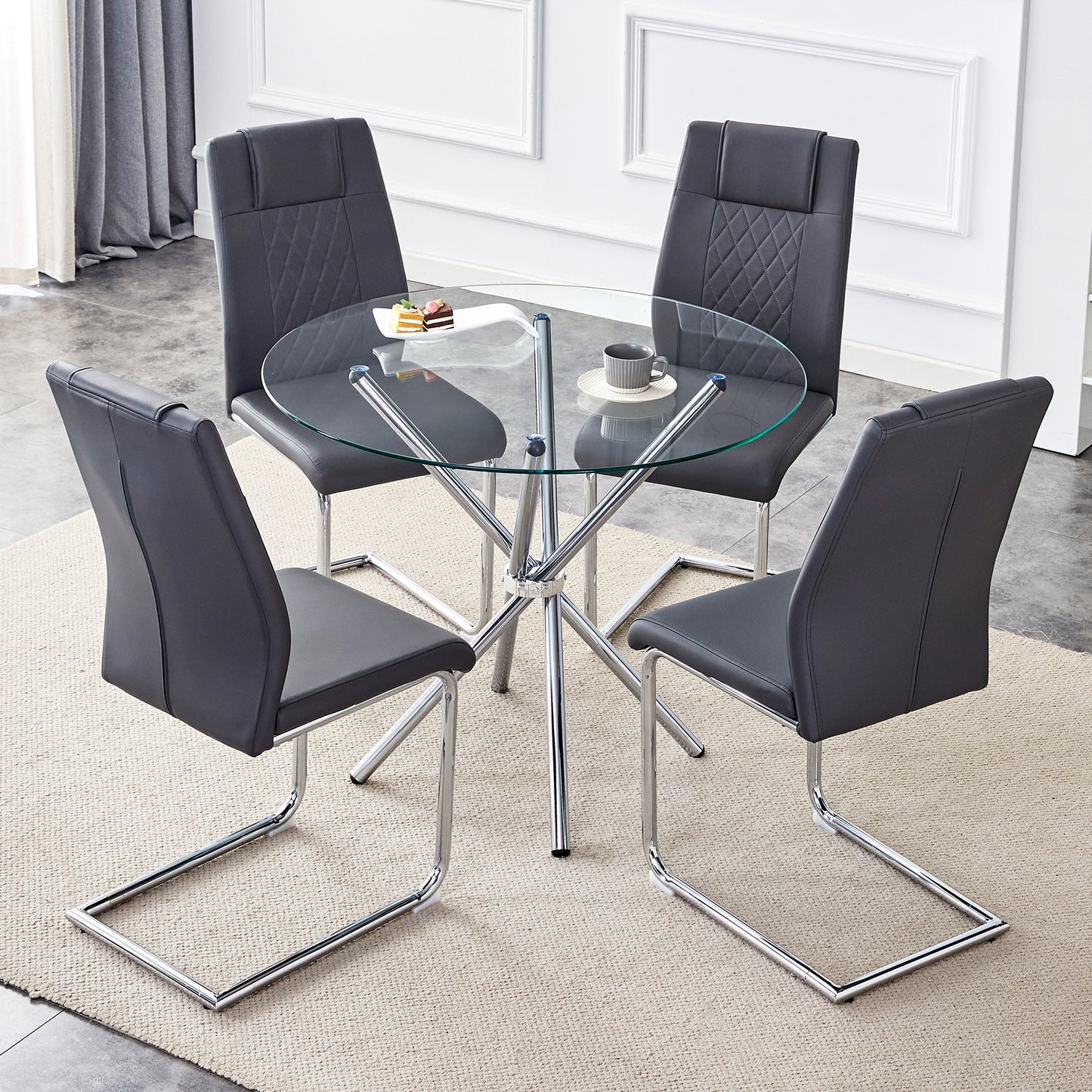 Modern glass dining table set with four dark gray faux leather chairs