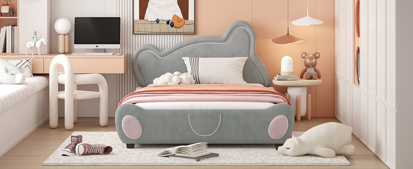 Grey upholstered kids bed with pink trim and cartoonish design