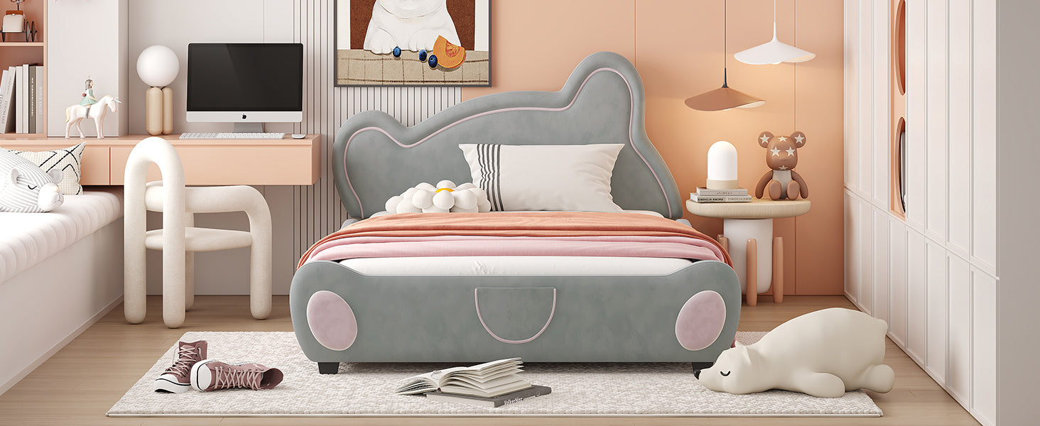 Grey upholstered kids bed with pink trim and cartoonish design