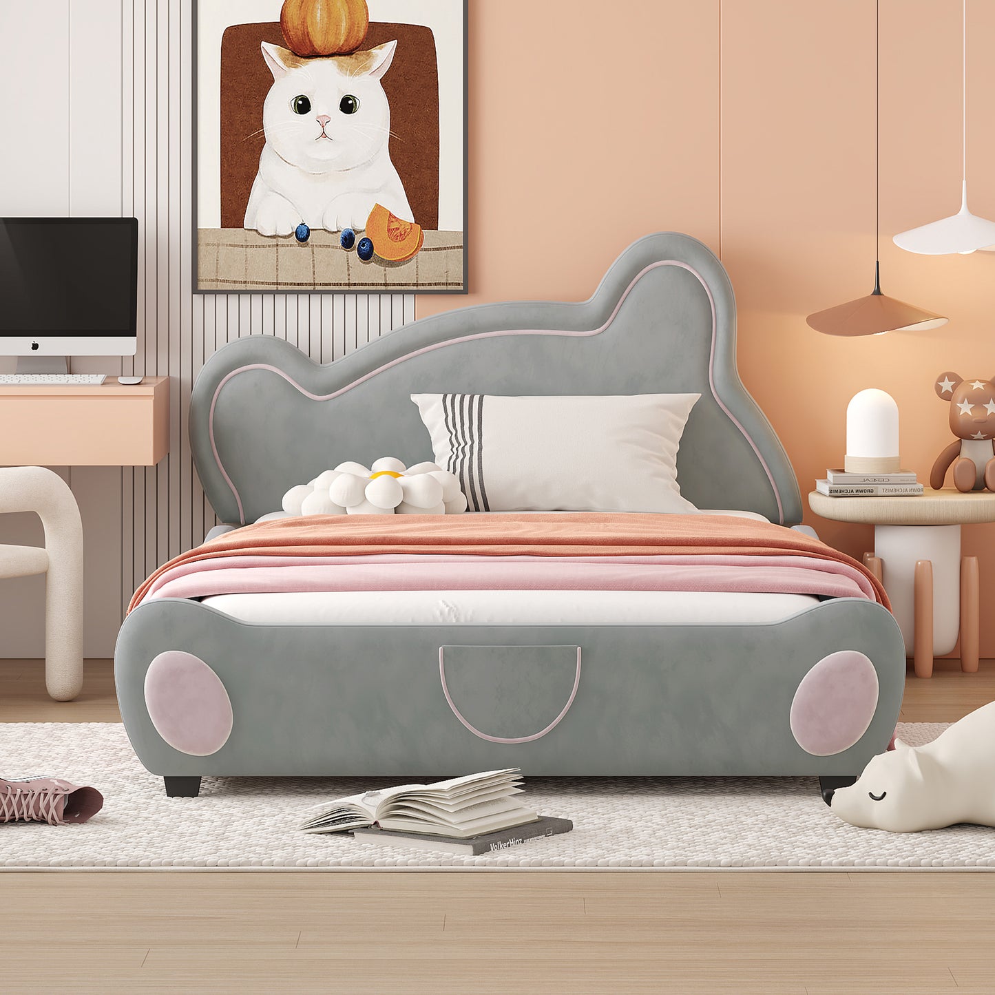 Grey upholstered twin bed with playful rounded edges and pink accents