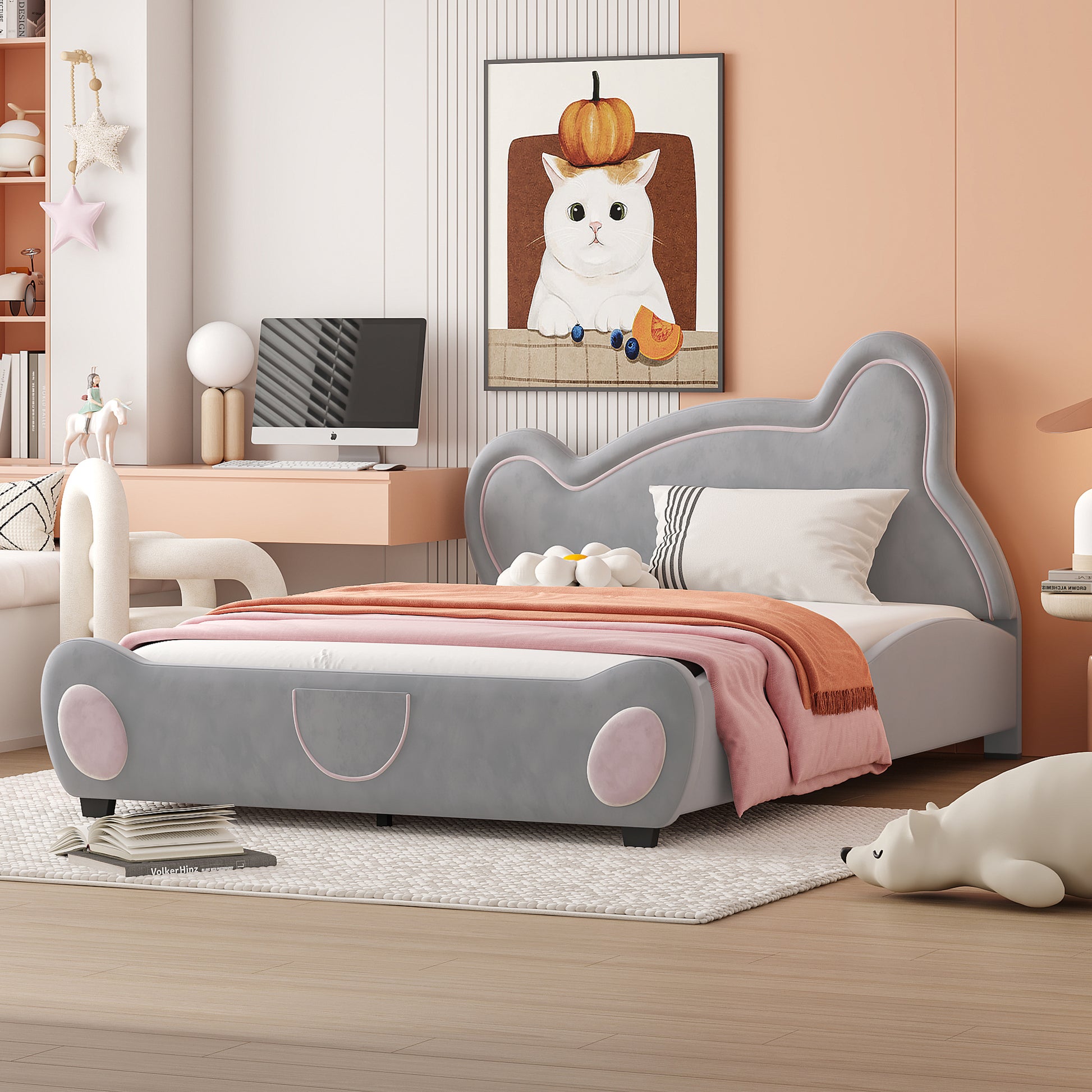 Grey upholstered car bed with pink accents for a childs bedroom