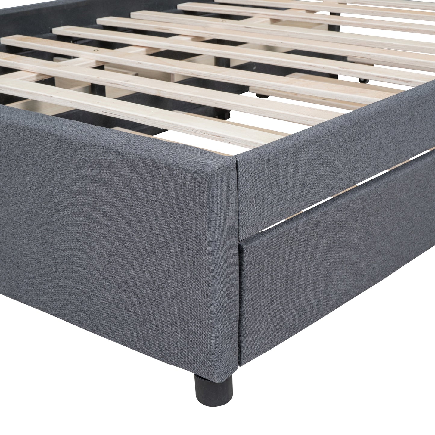 Closeup of grey upholstered bed frame with wooden slats