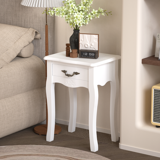 White ornate bedside table with a single drawer and antique brass pull