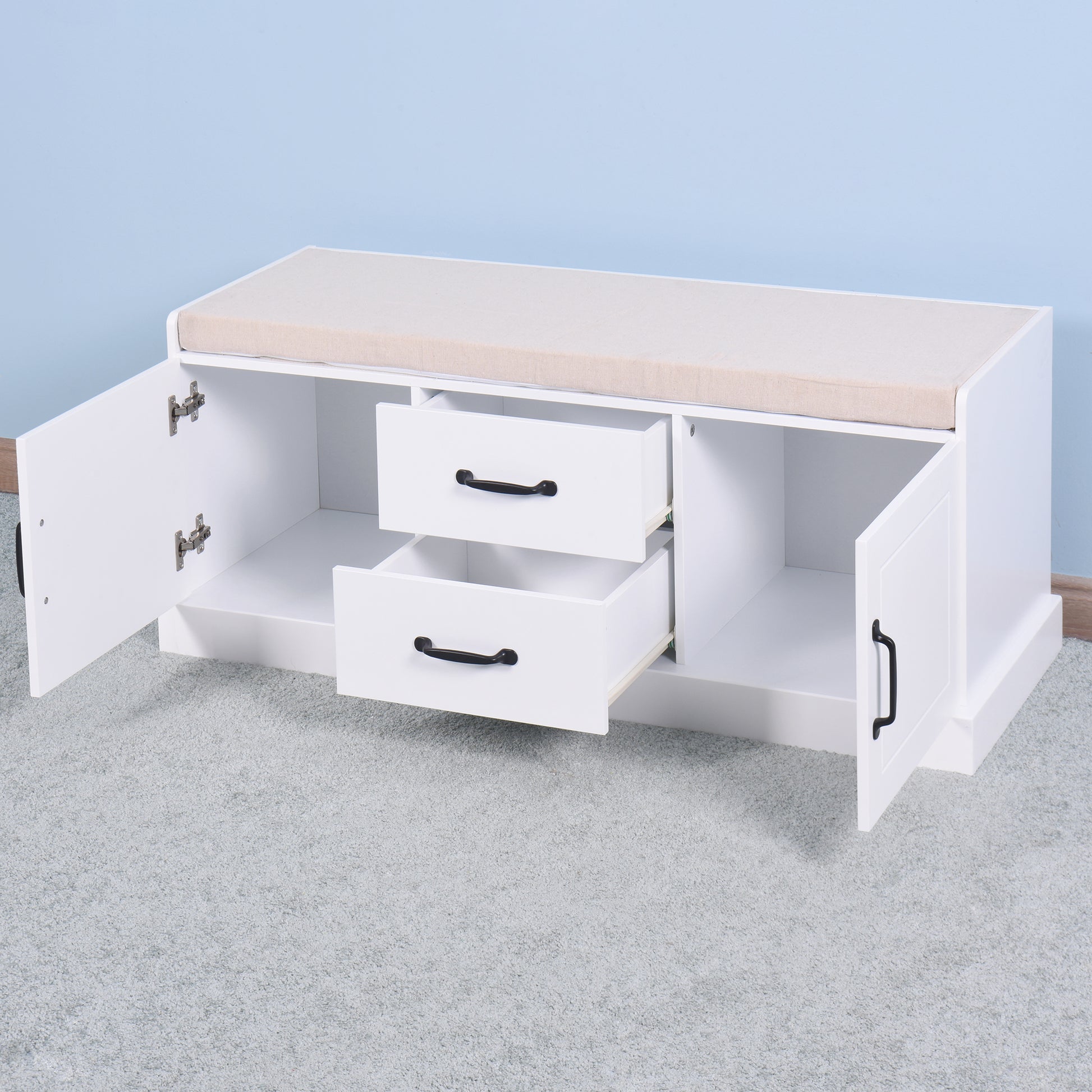 White entryway bench with cushioned seat and two drawers for shoe storage