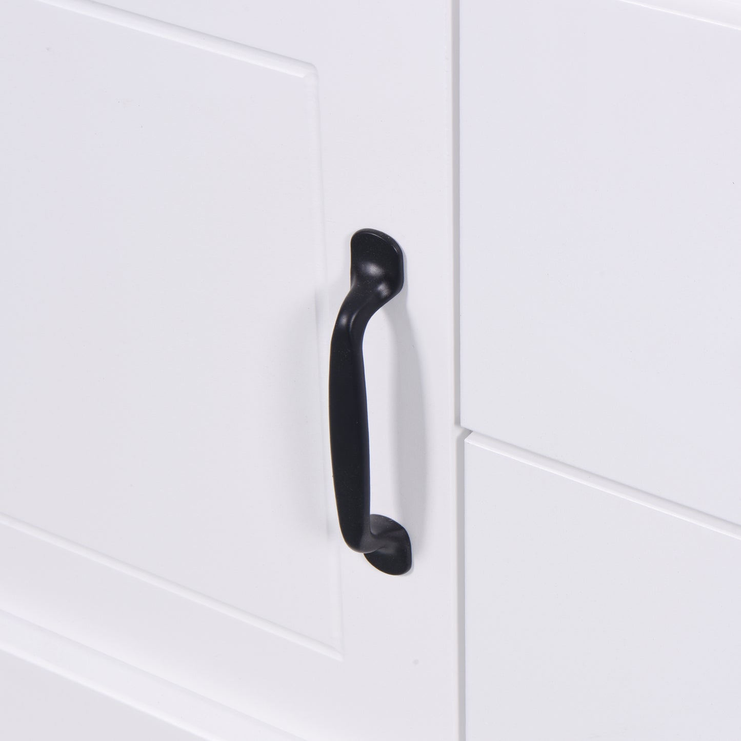 White cabinet door with a black bar pull handle
