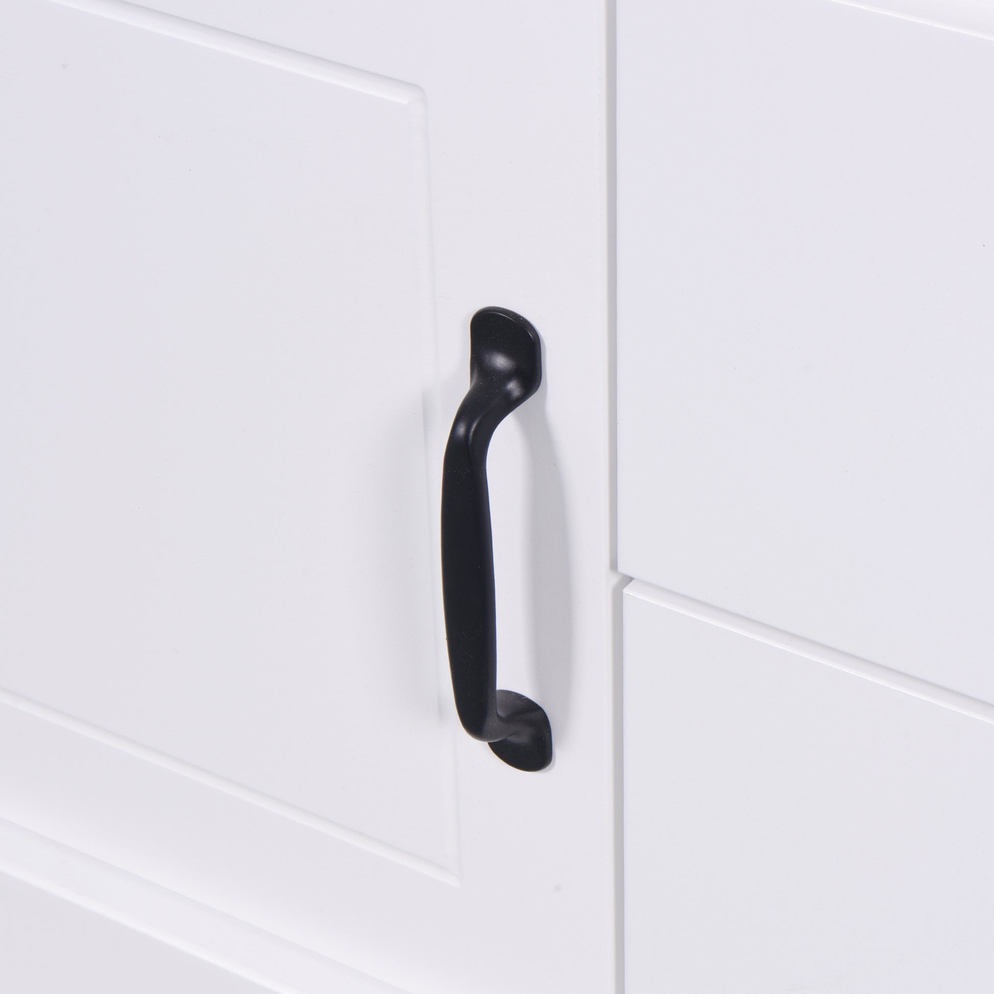 White cabinet door with a black bar pull handle