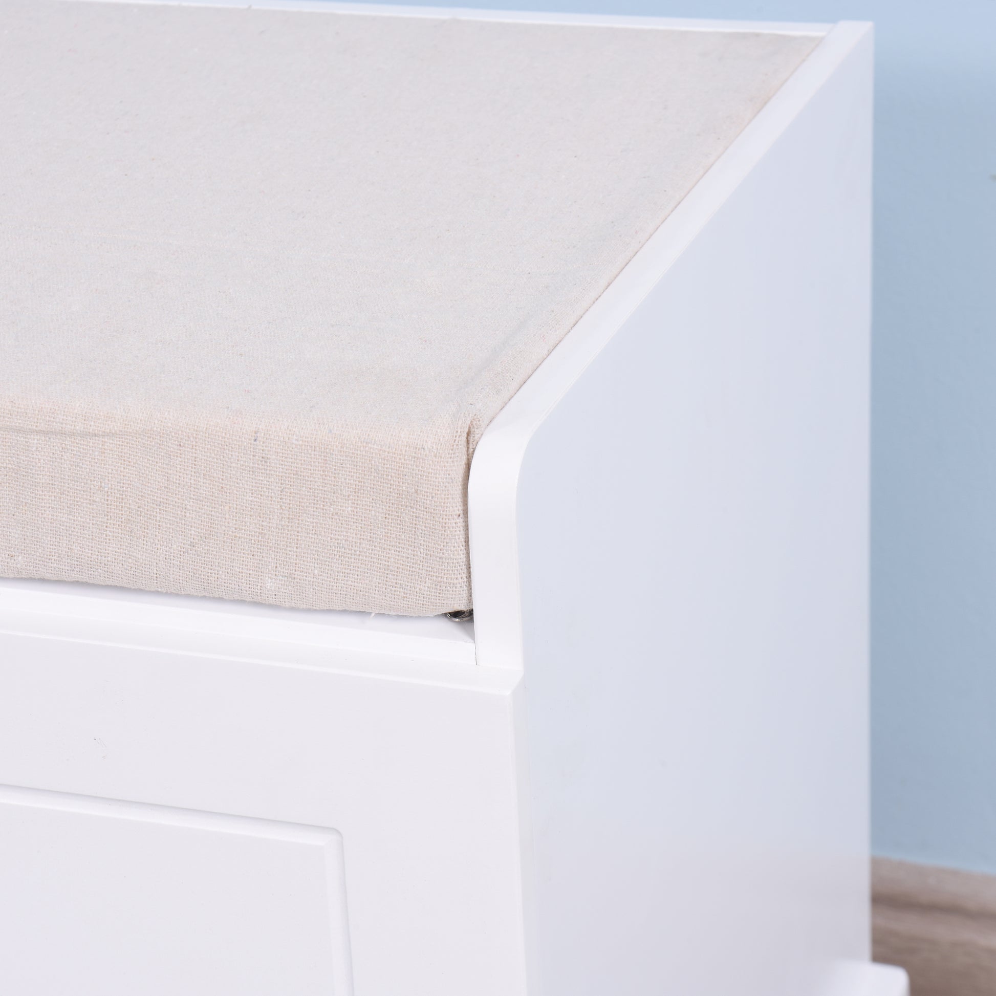 White storage bench with upholstered linen seat