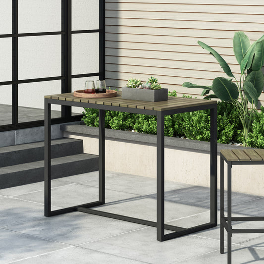 Modern outdoor bar table with woodslat top and black metal frame on patio