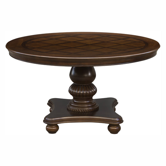 Dark brown round dining table with geometric inlay on top and pedestal base