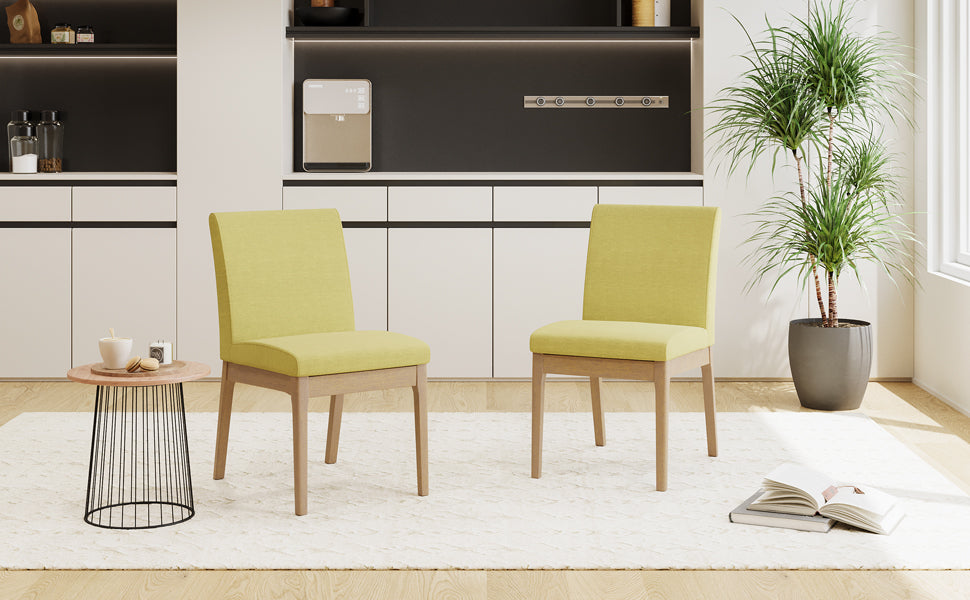 Two modern upholstered dining chairs in lime green with light wood legs