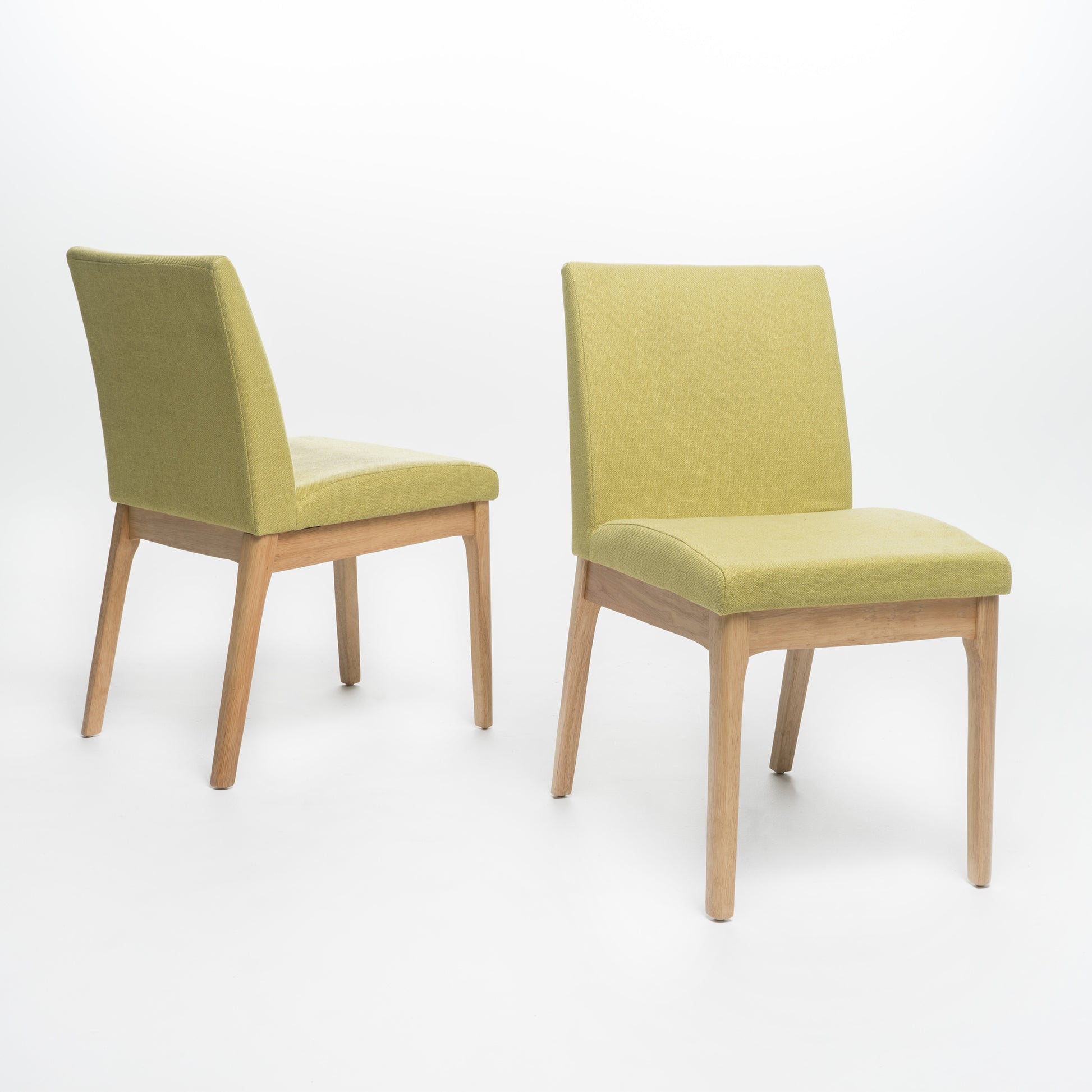 Modern dining chair with textured lime green fabric upholstery and natural wood legs