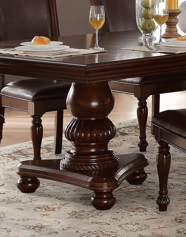 Rich mahogany pedestal dining table with carved base