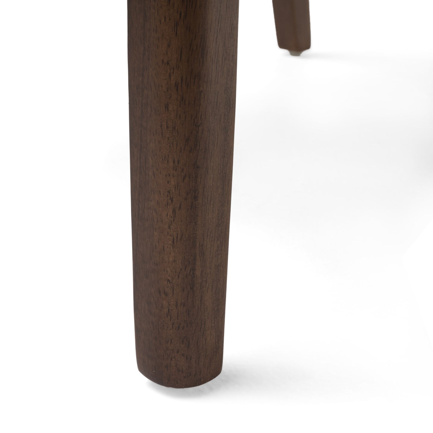 Closeup of a dark walnut wood table leg