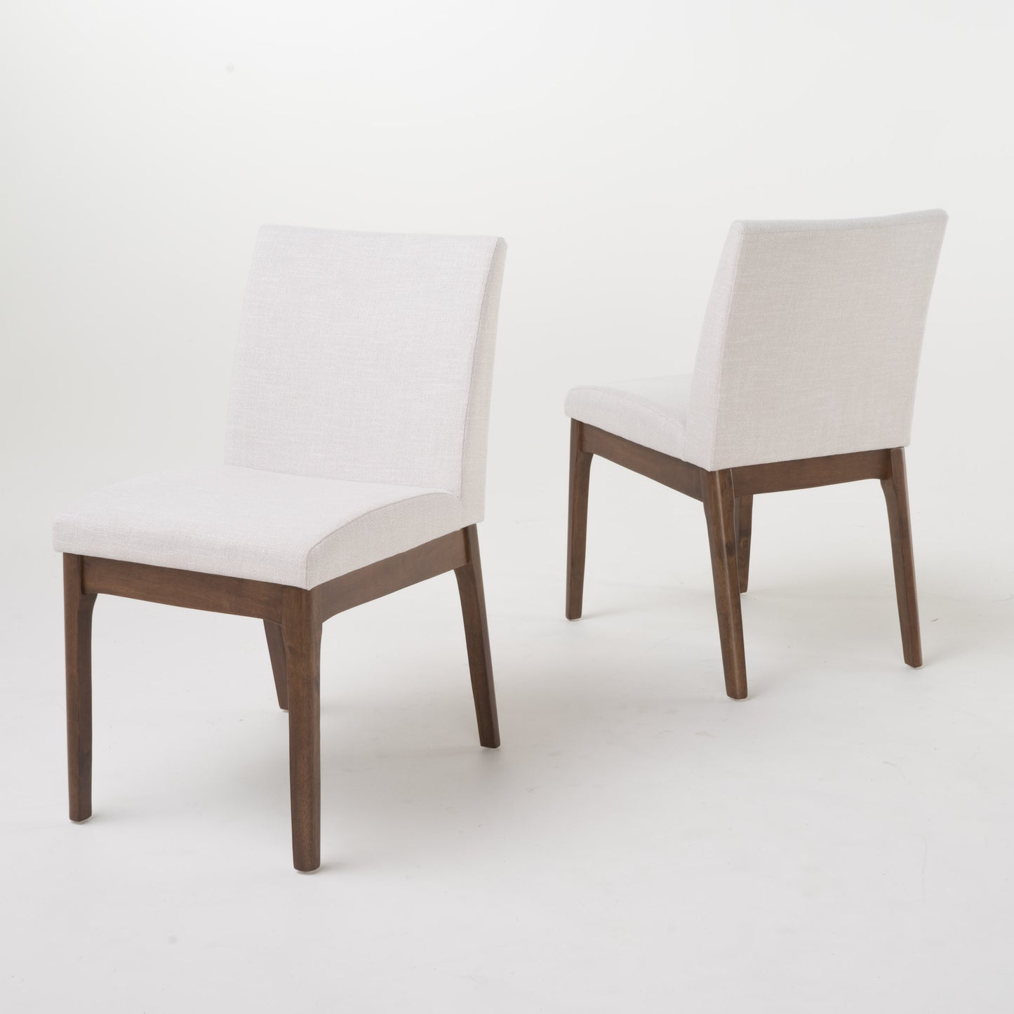 Modern dining chair with white linen upholstery and dark wood legs