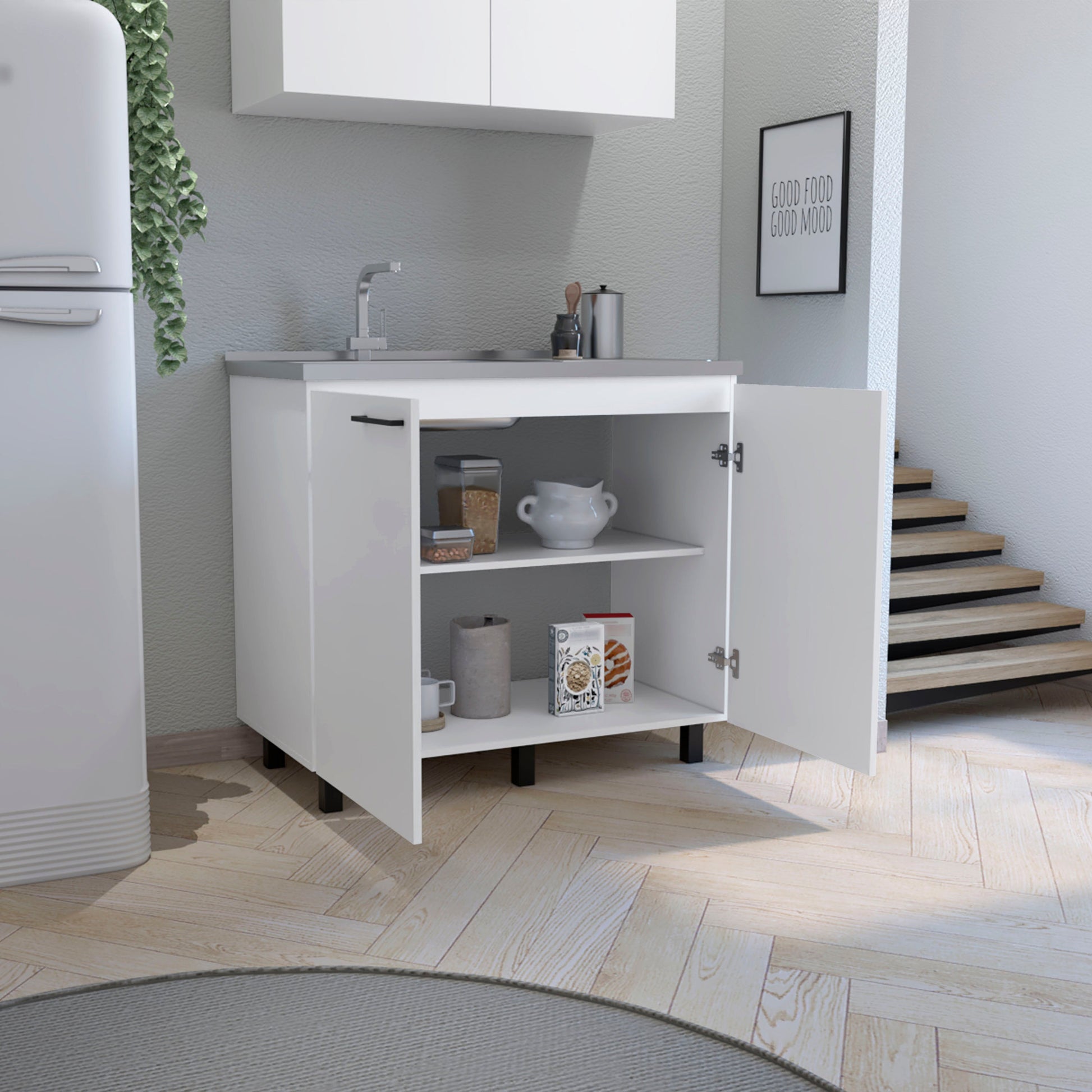 White kitchen cabinet with double doors and stainless steel countertop