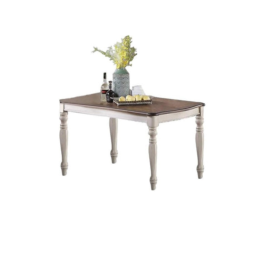 Rectangular wood dining table with distressed white legs and dark wood top