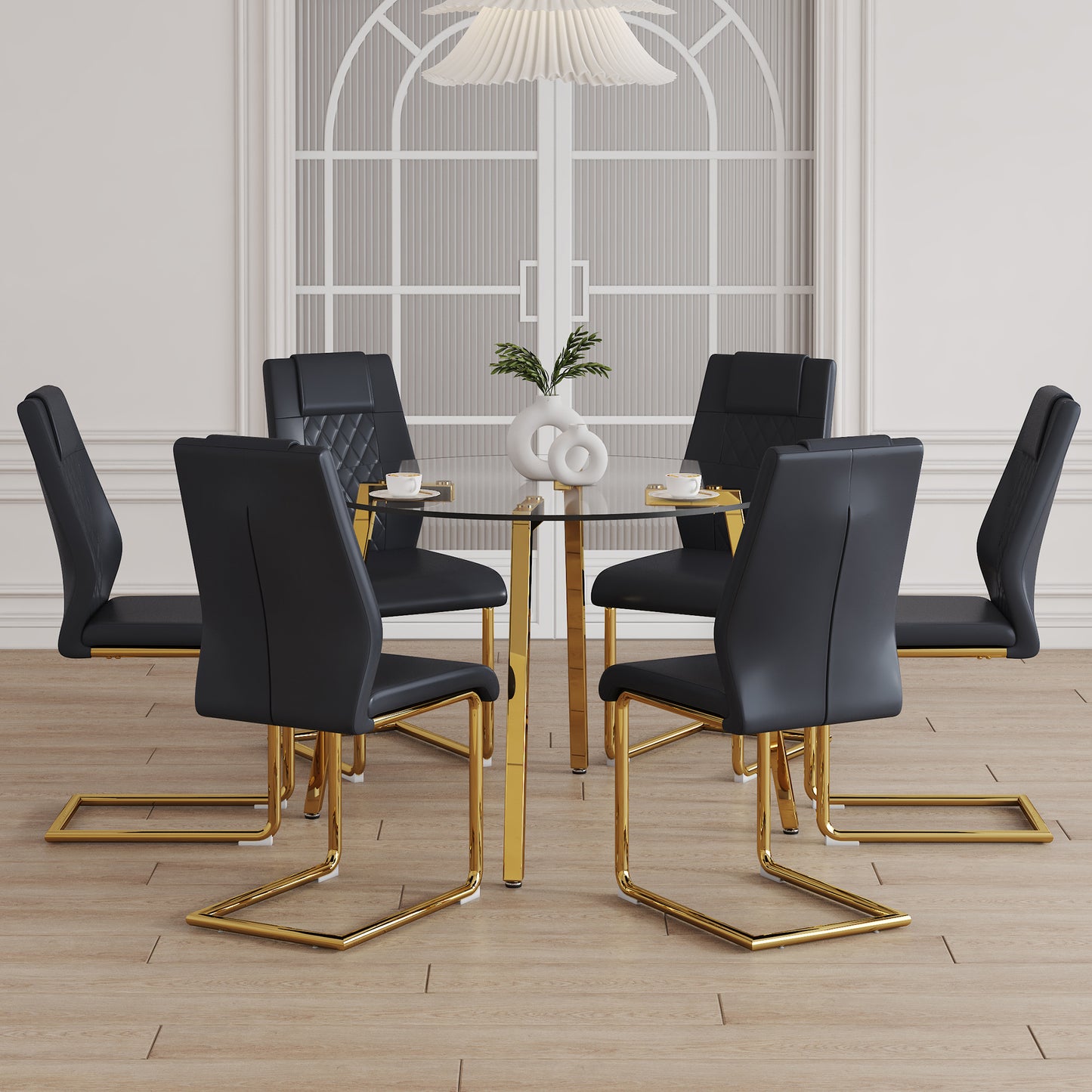 Black upholstered dining chairs with quilted backs and gold sled legs