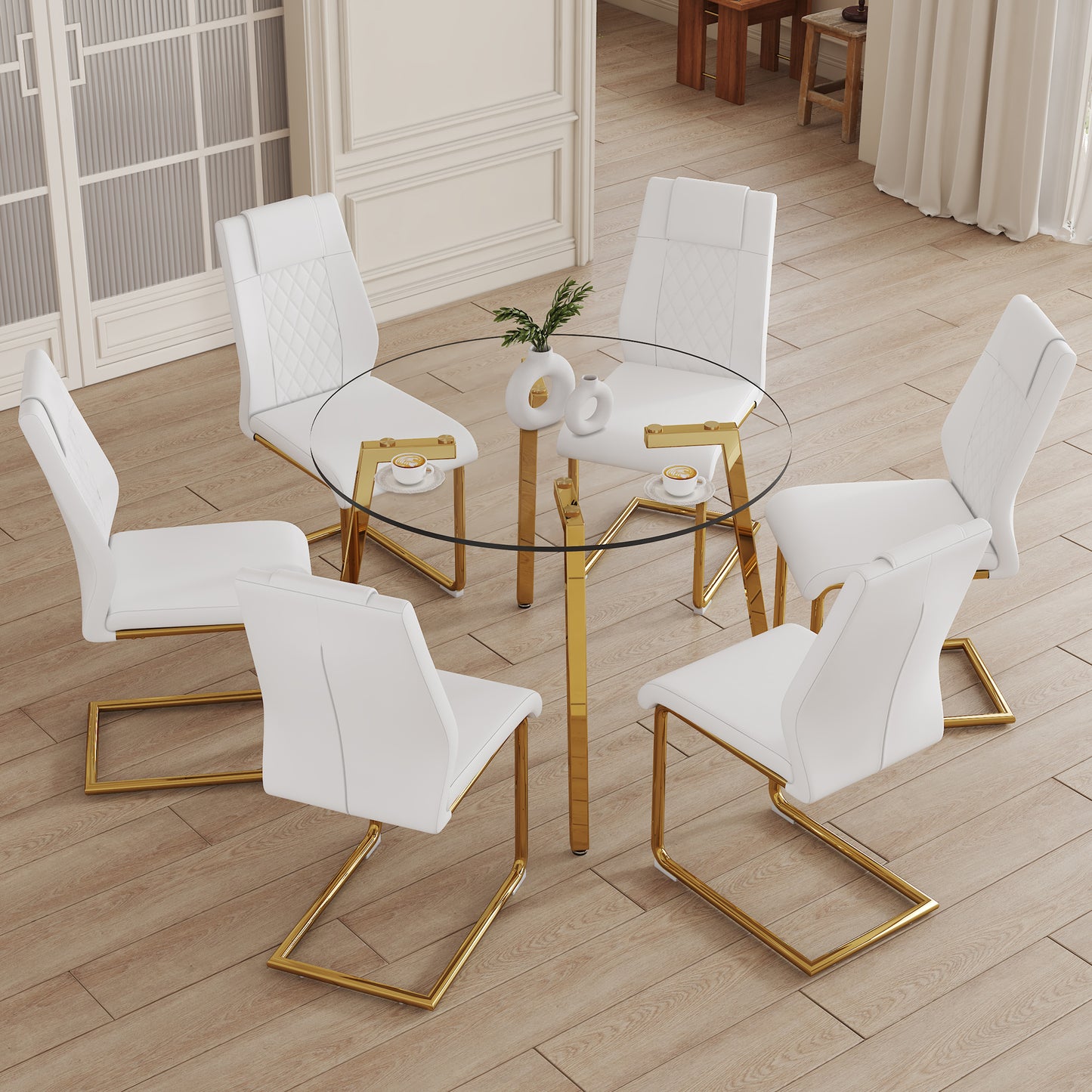 White faux leather dining chairs with diamond stitching and gold frames