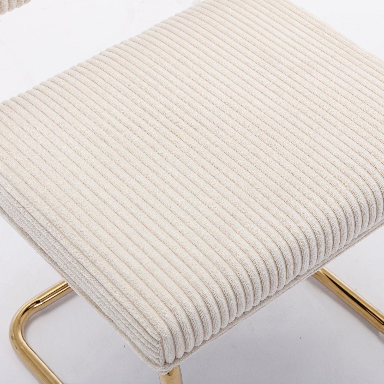 Cream corduroy upholstered bench with gold metal frame