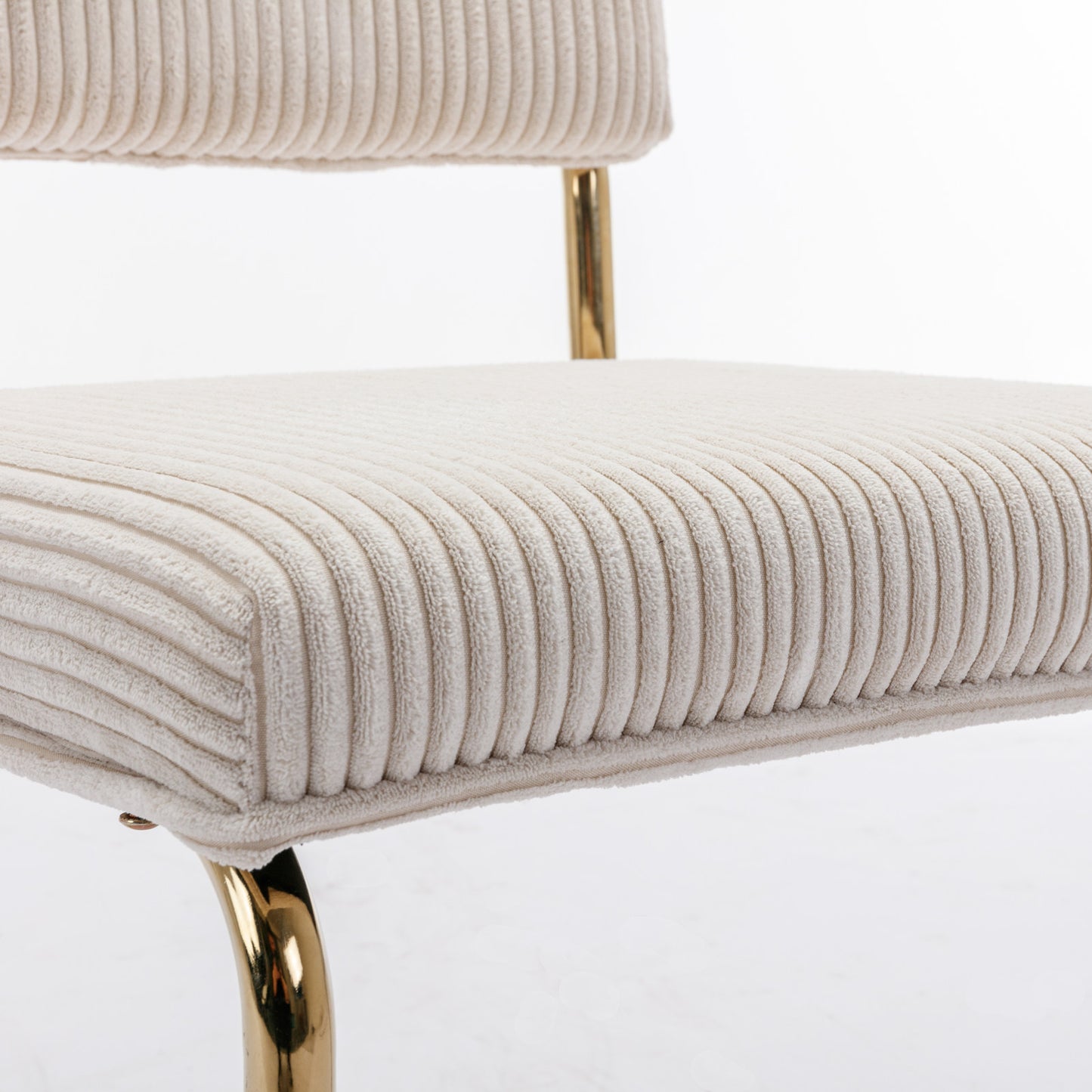 Cream corduroy accent chair with plush seat and gold metal legs