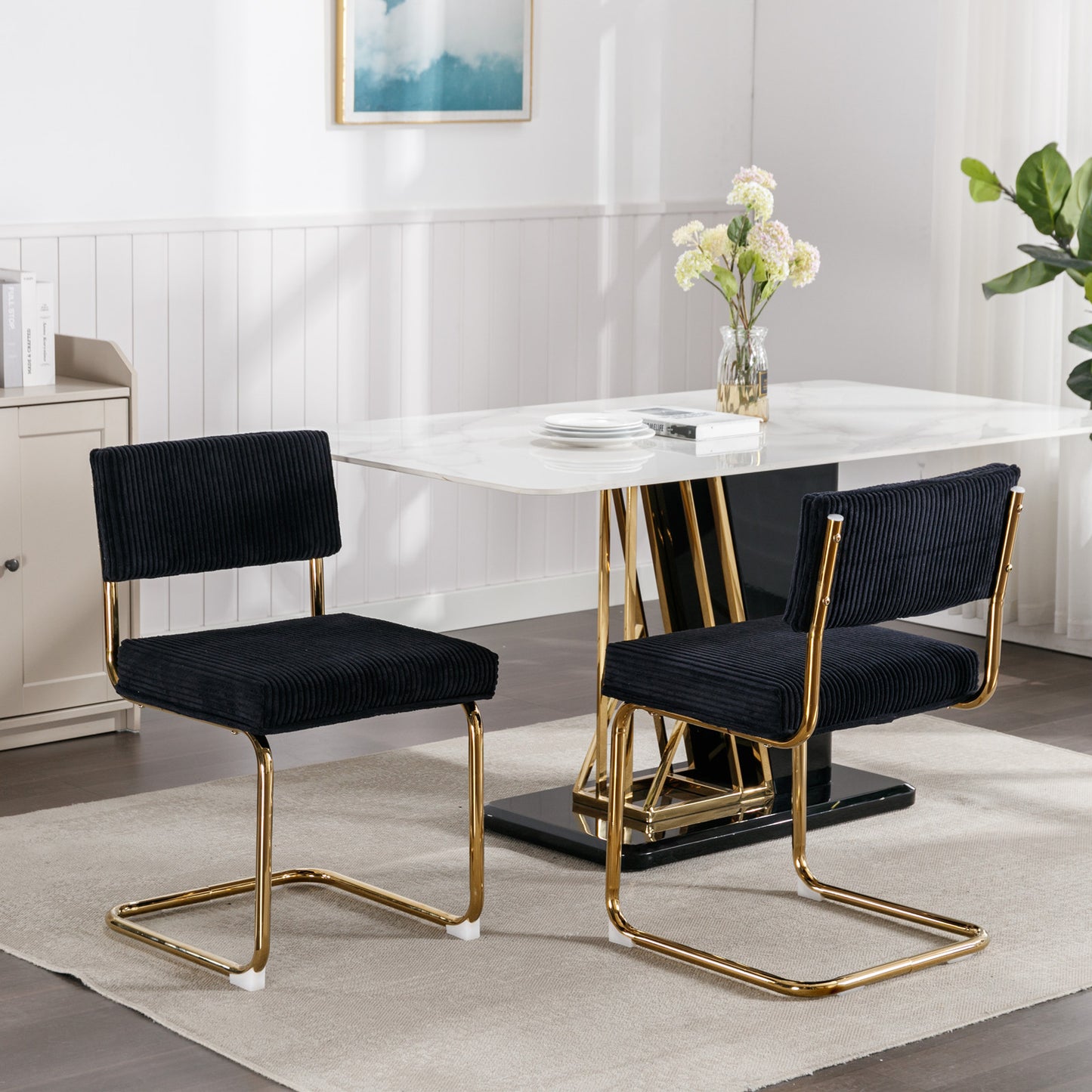 Black corduroy dining chair with gold metal frame and accent feet