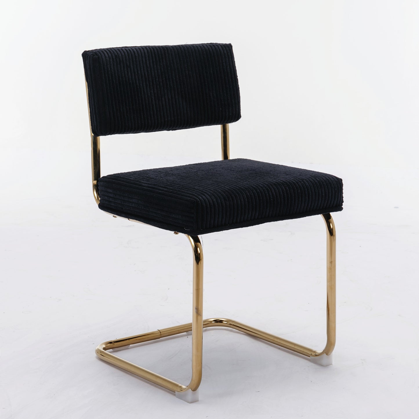 Black corduroy dining chair with gold metal legs