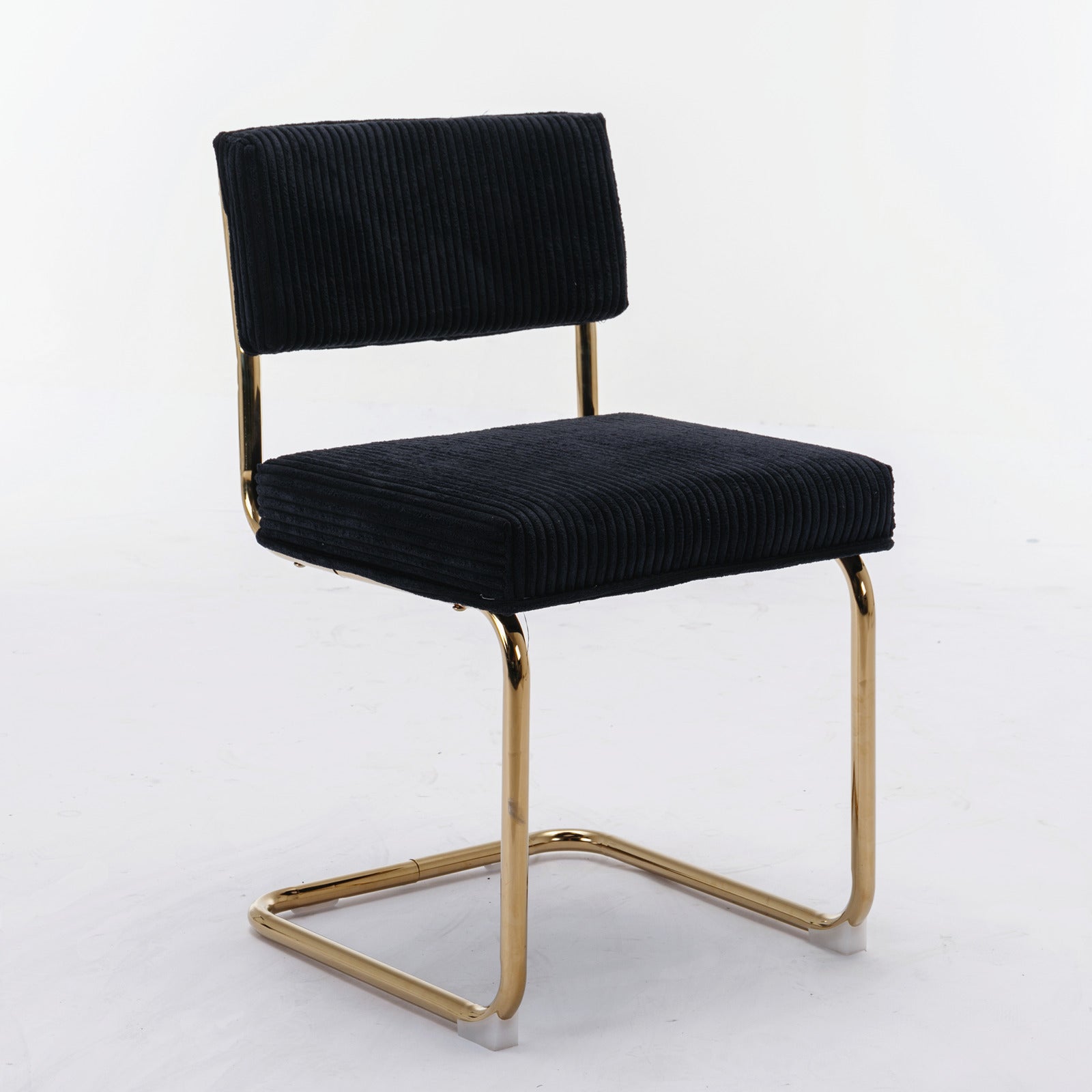 Black corduroy dining chair with gold metal legs