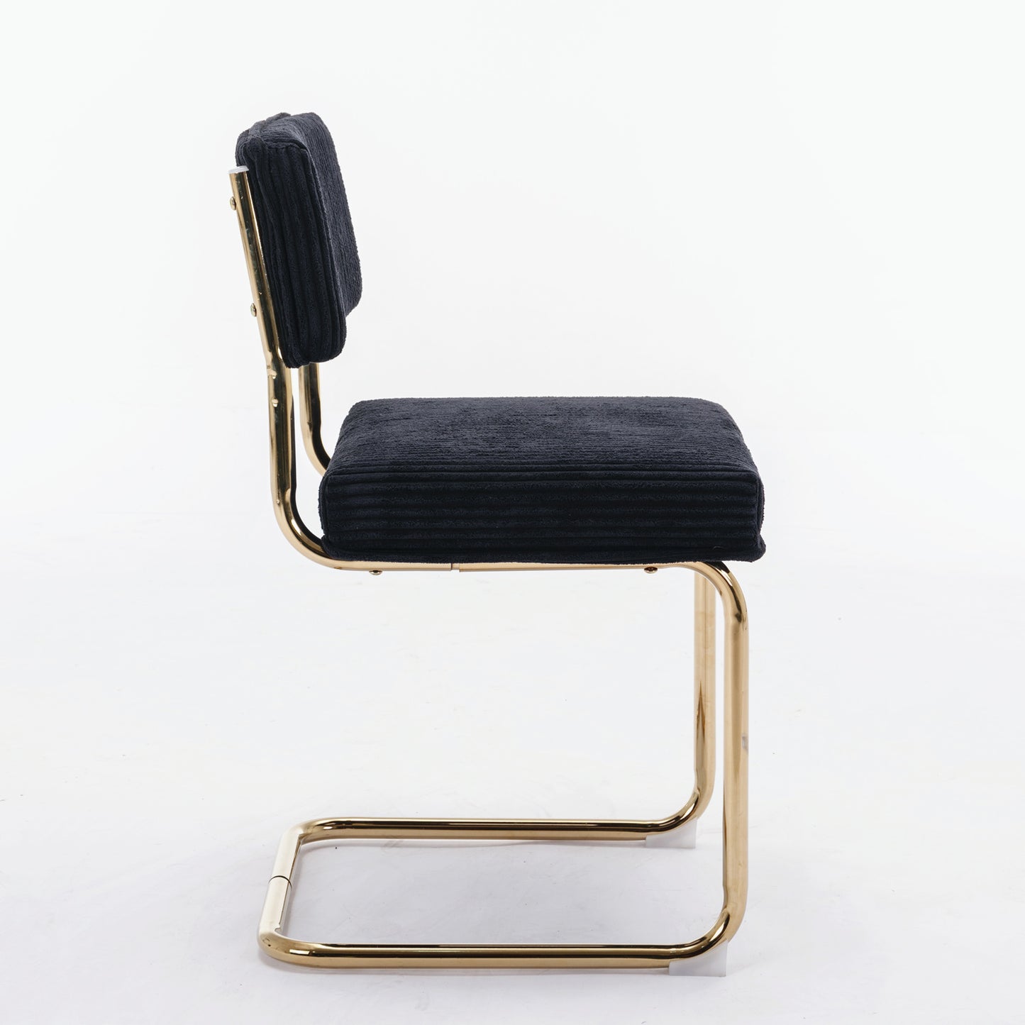Black corduroy accent chair with sleek gold cantilever frame