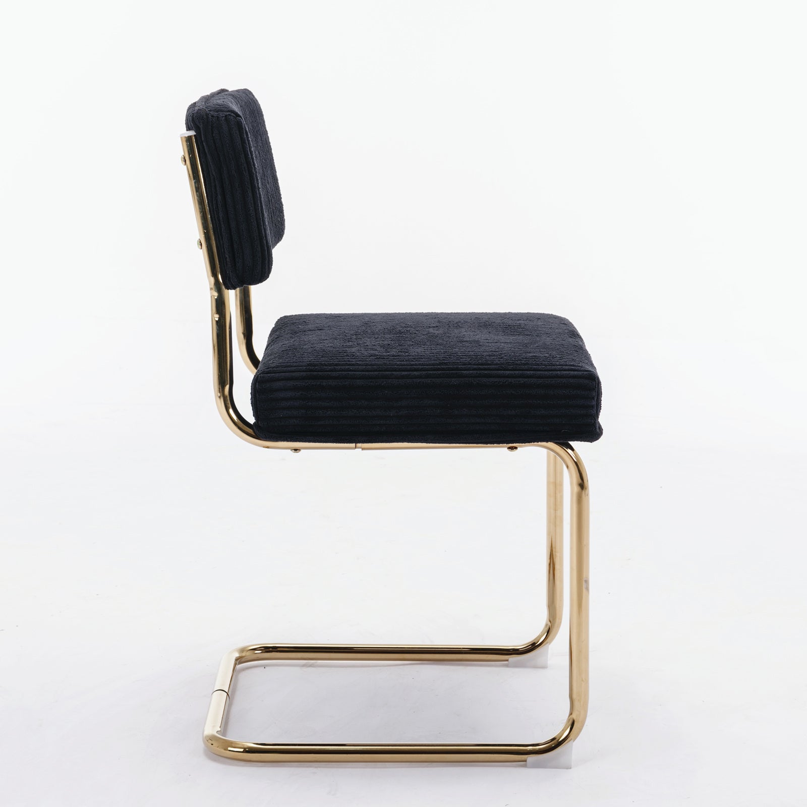 Black corduroy accent chair with sleek gold cantilever frame
