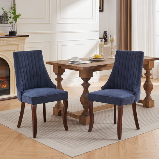 Upholstered navy blue dining chair with vertical channel tufting