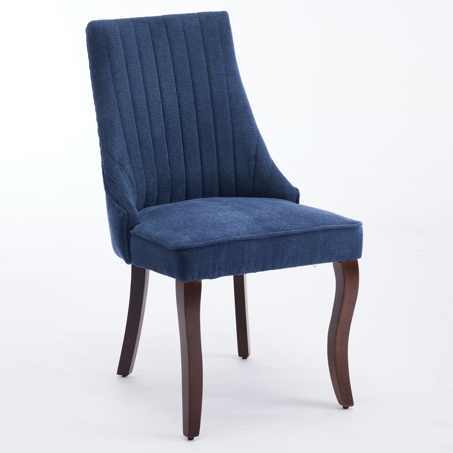 Upholstered dining chair in navy blue fabric with vertical tufting and dark wood legs
