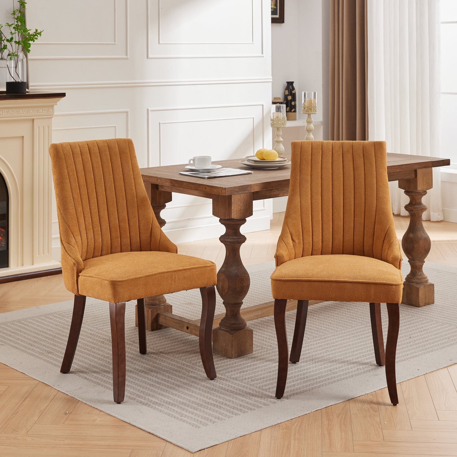 Orange fabric dining chair with channel tufting and dark wood legs