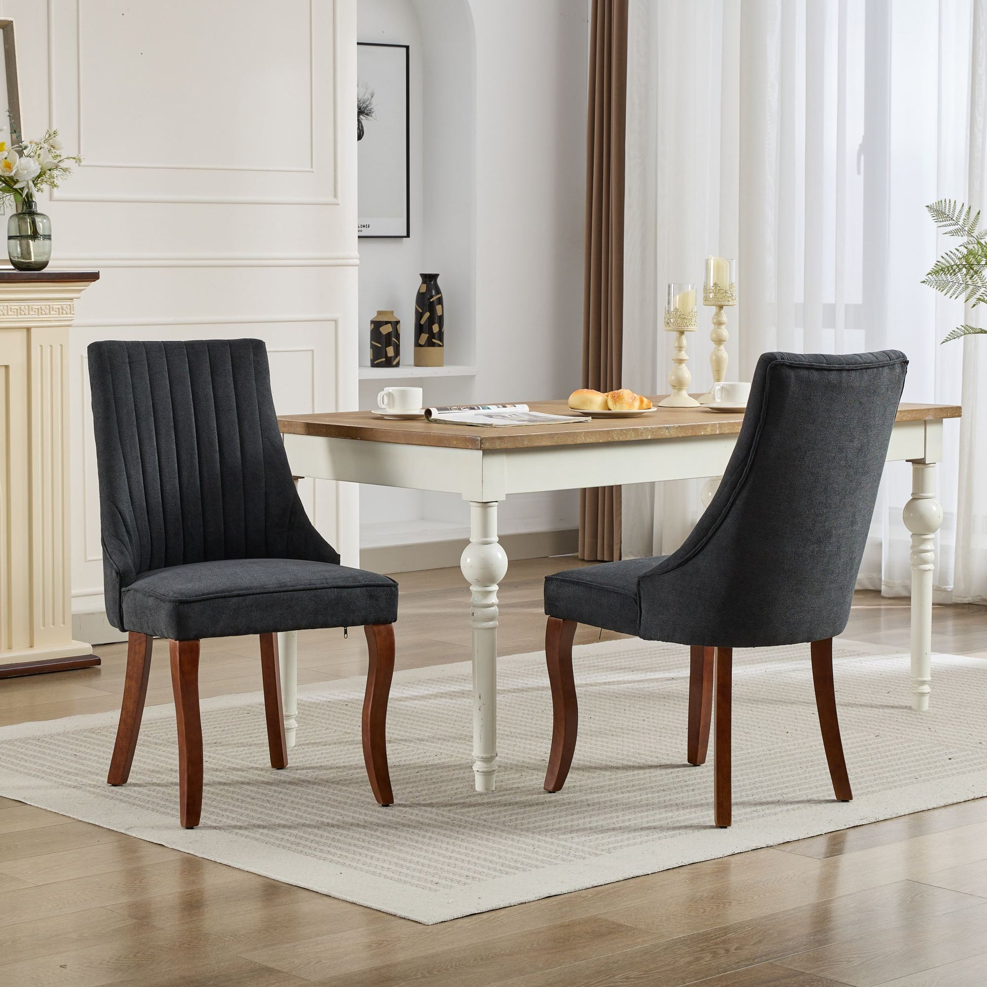 Dark gray fabric dining chair with fluted back and wooden legs
