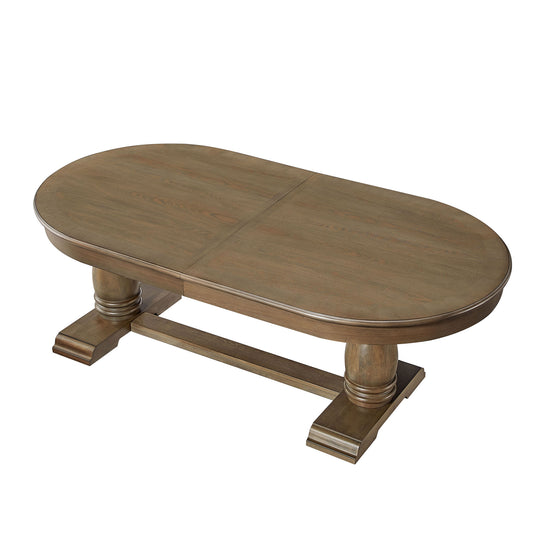 Oval pedestal dining table with a rustic wood finish
