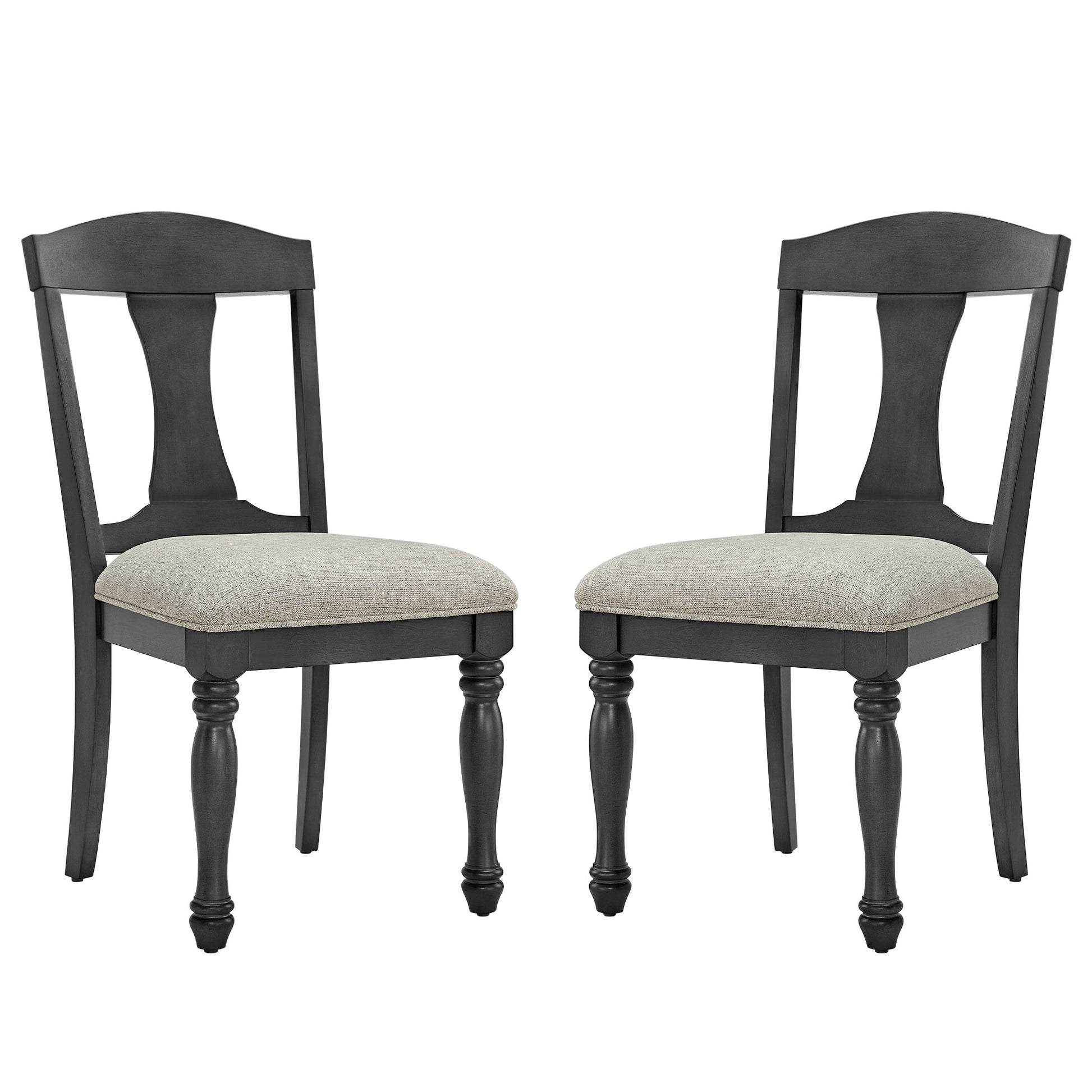 Two upholstered dining chairs with dark wood frames and carved legs