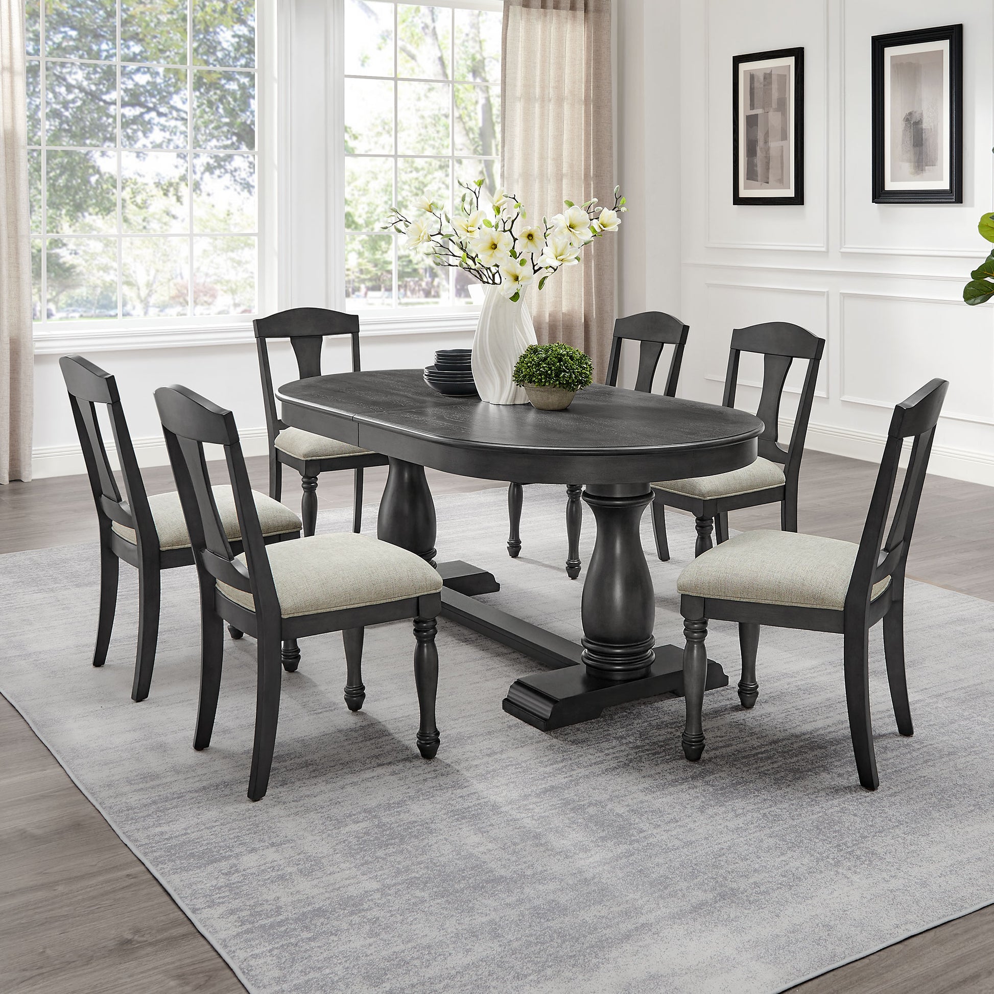 Dark wood oval dining table with six chairs