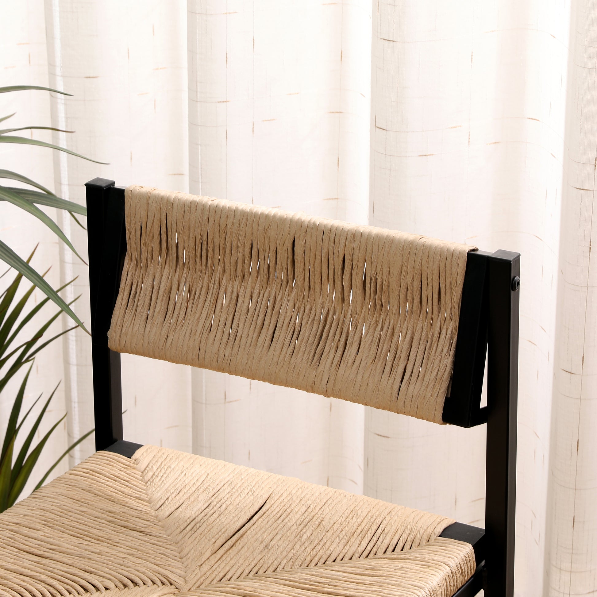 Black metal frame accent chair with woven natural rush seat and backrest