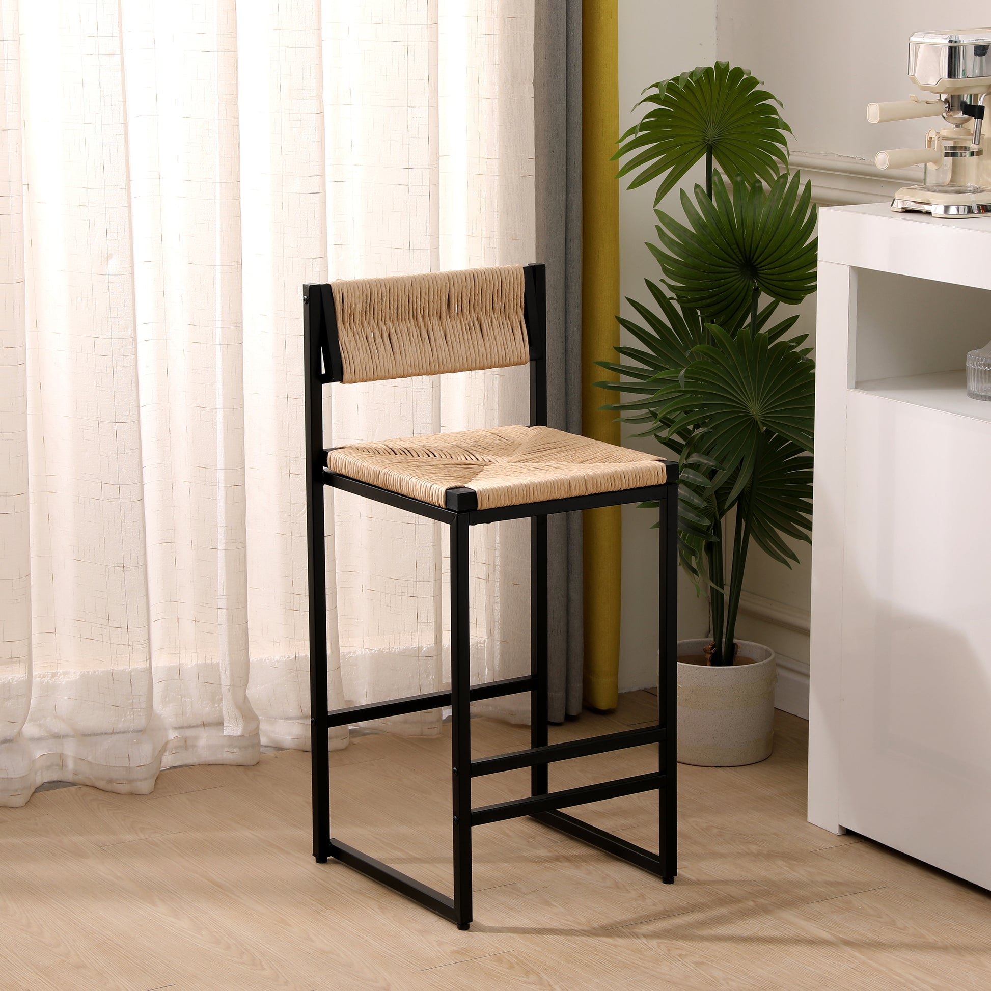 Black metal bar stool with woven natural raffia seat and backrest