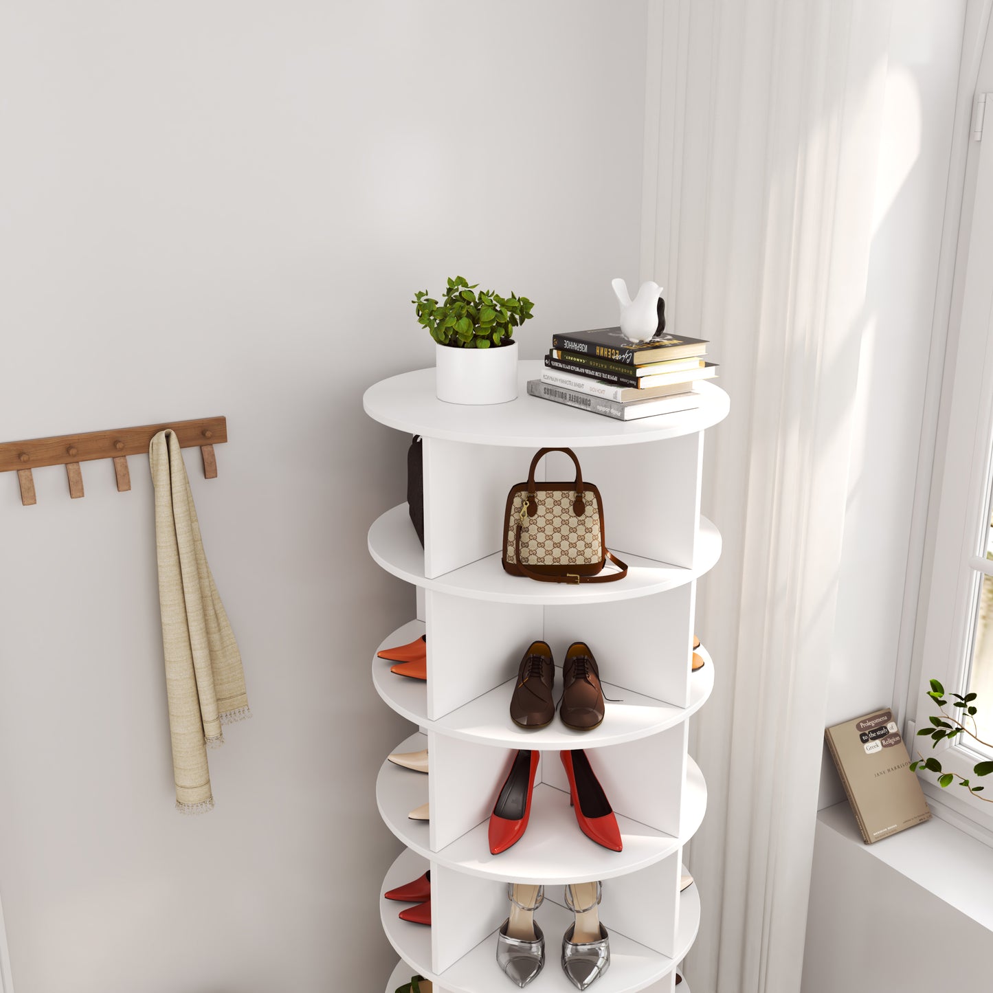 White rotating shoe rack with organized footwear and accessories