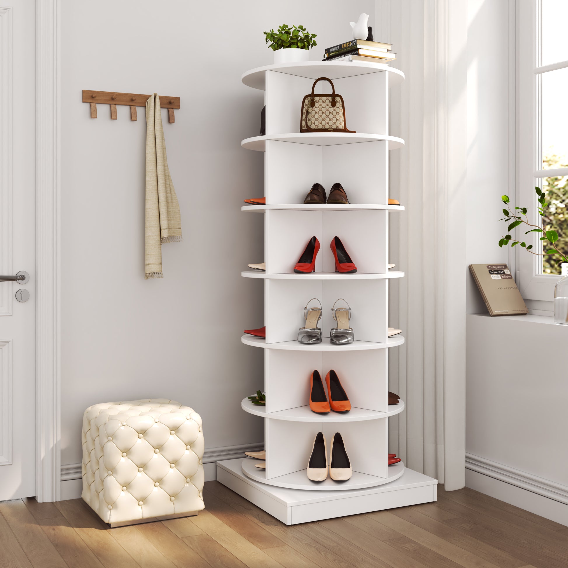 White rotating shoe rack displaying various womens shoes
