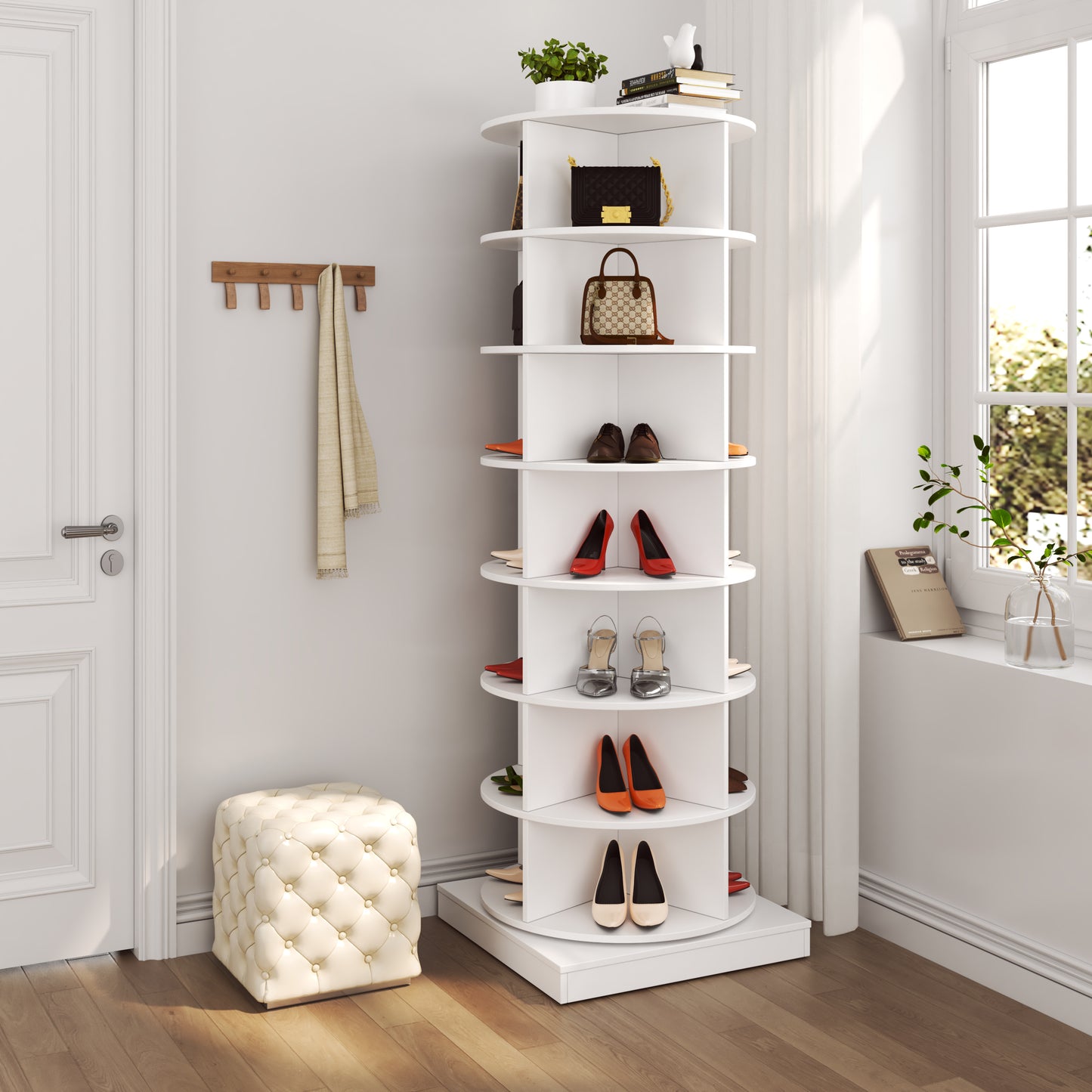 White rotating shoe rack with a black handbag on top shelf