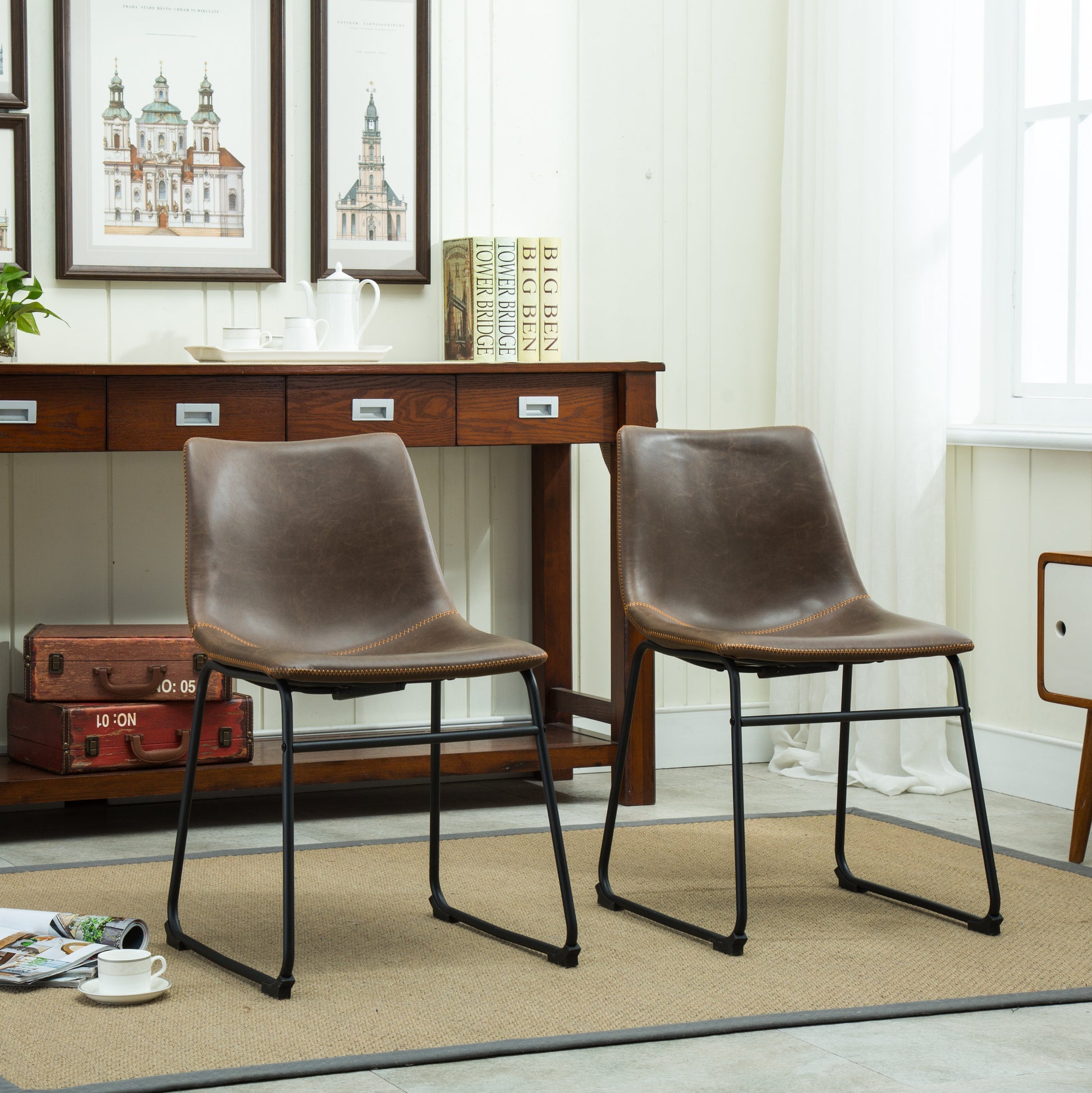 Brown faux leather accent chair with stitched details and black metal legs