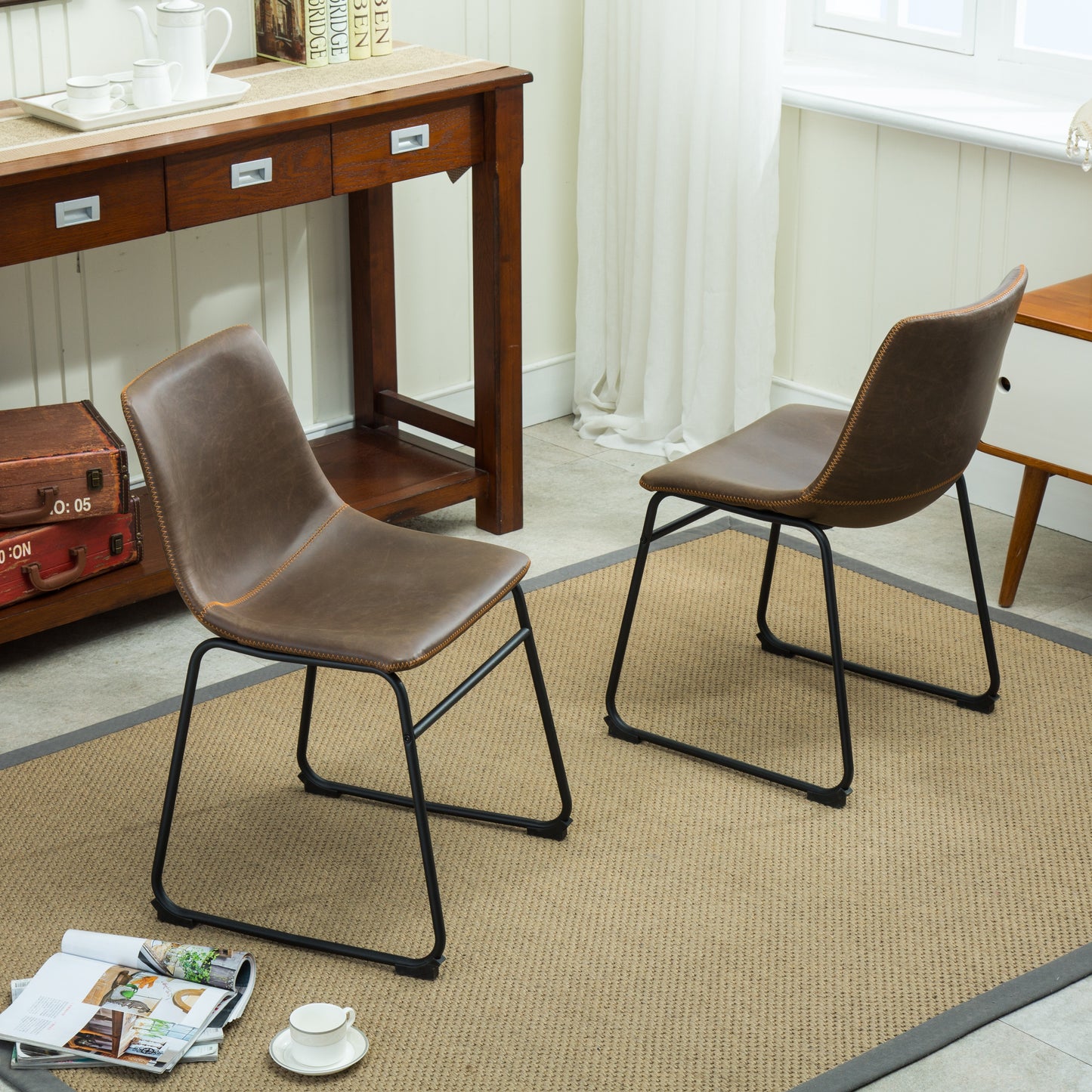 Brown faux leather dining chair with stitched accents and black metal legs